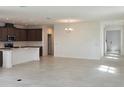 Bright and airy living space with tile floors, modern lighting, and an open floor plan at 14647 Crestavista Dr, Clermont, FL 34714
