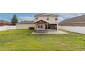 Large backyard featuring a charming gazebo with patio seating at 1710 Alejo Dr, Apopka, FL 32712