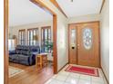 Inviting home entryway featuring hardwood floors and a decorative glass front door at 2102 E Atmore Cir, Deltona, FL 32725