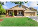 Charming single-Gathering home featuring a well-manicured lawn and attached two car garage at 3281 Pawleys N Loop, St Cloud, FL 34769
