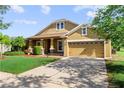 Charming single-Gathering home featuring a well-manicured lawn and attached two car garage at 3281 Pawleys N Loop, St Cloud, FL 34769