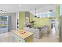 Open living room with fireplace and sliding glass doors to the backyard at 578 Darkwood Ave, Ocoee, FL 34761