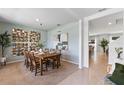 Well-lit dining room featuring decor elements and ample seating for six at 786 Mocking Jay Ln, St Cloud, FL 34771