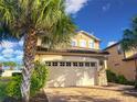 Charming two-story home with well-maintained landscaping and a spacious two car garage at 8961 Rhodes St, Kissimmee, FL 34747