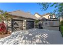 Charming home featuring a two-car garage and decorative wall, showcasing a blend of modern design and curb appeal at 9624 Bryanston Dr, Orlando, FL 32827
