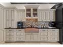 Well-appointed kitchen showcases a farmhouse sink, custom cabinets, and modern appliances at 9624 Bryanston Dr, Orlando, FL 32827