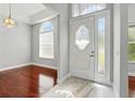 Elegant entryway with marble flooring, decorative door, and lots of natural light at 1851 Sweetwater West Cir, Apopka, FL 32712