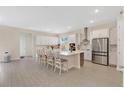 Spacious, bright kitchen features a large center island, stainless steel appliances, and ample cabinet space at 19334 Banfield Pl, Orlando, FL 32827