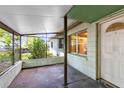 Screened in covered porch with view of the front yard and front door at 226 S Apollo Dr, Apopka, FL 32703