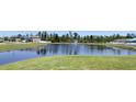 Community pond with fountain and well-maintained grassy shoreline at 271 Tanglewood Dr, Davenport, FL 33896