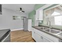 Open kitchen with modern cabinetry, stainless steel appliances, and updated features at 2903 E Michigan St, Orlando, FL 32806