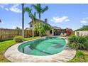 Backyard pool with mature landscaping and privacy fence at 368 Amethyst Ct, Lake Mary, FL 32746