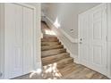 Bright stairway with wood flooring, white trim, and a clean, modern design at 7021 Della Dr # 52, Orlando, FL 32819