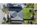 Aerial view of the home's roof and well maintained backyard with lush green grass and a privacy fence at 8565 Tallfield Ave # 1, Orlando, FL 32832