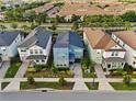 Aerial view showcases the home's location within a beautifully landscaped neighborhood, highlighting its curb appeal at 8953 Amelia Downs Trl, Kissimmee, FL 34747