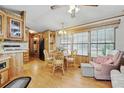 Cozy dining area with hardwood floors, traditional cabinets, and natural light from the window at 9000 Us Highway 192 # 624, Clermont, FL 34714