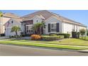 Well-maintained single-story home featuring manicured lawns and attractive landscaping at 970 Timberview Rd, Clermont, FL 34715