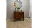 Entryway with wood dresser, mirror, and stylish decorations offering a warm welcome at 9978 Tivoli Villa Dr, Orlando, FL 32829