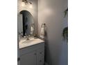 Cozy powder room featuring modern fixtures, vanity, and decor enhancing its appeal at 9978 Tivoli Villa Dr, Orlando, FL 32829