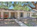 Inviting home exterior with a tidy walkway and vibrant landscaping elements at 107 Larkwood Dr, Sanford, FL 32771