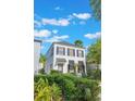Stylish two-story home with dark shutters and manicured landscaping for curb appeal at 1117 Damask St, Celebration, FL 34747