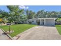 Charming single-story home with a well-maintained lawn and inviting curb appeal at 132 W Lauren Ct, Casselberry, FL 32730