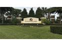 Beautiful entrance to Summerlake, featuring lush landscaping, colorful flowerbeds, and a welcoming community sign at 14841 Porter Rd, Winter Garden, FL 34787