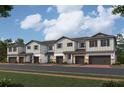 Charming exterior of modern townhomes featuring unique architectural details and neutral color palettes at 14934 Harvest St, Orlando, FL 32824