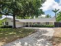 Inviting single-story residence featuring a well-kept lawn, covered porch, and a neatly paved driveway at 2004 Mohawk Trl, Maitland, FL 32751