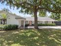 Well-maintained single-story home with mature landscaping, covered entrance, and a welcoming atmosphere at 2004 Mohawk Trl, Maitland, FL 32751