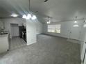 Inviting living room with open floor plan, seamlessly connecting to the modern kitchen at 2435 W Park Dr., Deland, FL 32724