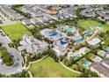 Aerial view of the community pool and clubhouse with water slides and playground at 416 Southfield St, Kissimmee, FL 34747