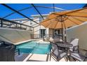 Private backyard pool with a screened enclosure, perfect for relaxation and outdoor entertainment at 4188 Paragraph Dr, Kissimmee, FL 34746