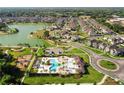 Aerial view of the community pool and playground, highlighting the amenities and Gathering-friendly environment of the neighborhood at 459 Dancing Water Dr, Winter Springs, FL 32708