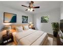 Cozy bedroom with plush bedding, soft lighting and windows with lovely outdoor views at 5939 Stokes Rd, Lakeland, FL 33812