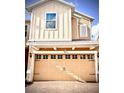 Attached two car garage door with decorative windows, hardware, and the house number above at 6863 Tussilago Way, Orlando, FL 32822