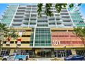 Modern high-rise building at 101 EOLA with sleek architecture and parking garage at 101 S Eola Dr # 1018, Orlando, FL 32801