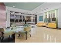 Modern building lobby with large windows, stylish seating, and contemporary decor at 101 S Eola Dr # 1018, Orlando, FL 32801