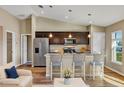 Bright kitchen with granite countertops, stainless steel appliances, and a breakfast bar for casual dining at 16771 Sw 21St Terrace Rd, Ocala, FL 34473