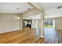 Spacious living room featuring hardwood floors and an open view to the kitchen at 16771 Sw 21St Terrace Rd, Ocala, FL 34473