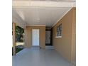Spacious carport area with access to storage and the home's entrance, providing sheltered parking at 2013 Sarazen Ct, Orlando, FL 32808