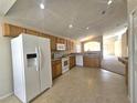 Open kitchen with plenty of cabinet space, modern appliances and views into the living area at 224 Lake Charles Dr, Davenport, FL 33837