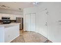 Neutral entryway featuring tiled flooring, coat closet, and white front door at 3621 Conroy Rd # 738, Orlando, FL 32839