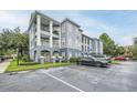 Multi-story condo with balconies, elegant architecture, landscaping, and parking at 3621 Conroy Rd # 738, Orlando, FL 32839