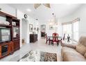 Inviting living room featuring neutral walls, tile flooring, arched doorways and an open layout with ample natural light at 401 Harbor Winds Ct, Winter Springs, FL 32708