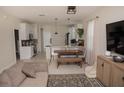 Open concept living area with modern finishes, ample seating, and seamless flow to the kitchen at 900 S Maple Ave, Sanford, FL 32771