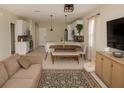 Inviting living space with modern decor, a dining area, and open access to the kitchen at 900 S Maple Ave, Sanford, FL 32771