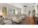 Comfortable living room with ample natural light, hardwood floors, and neutral decor at 12 N Forest Ave, Orlando, FL 32803