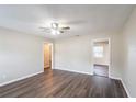 Inviting living room with ceiling fan, modern laminate flooring, and neutral wall paint at 1411 N Powers Dr, Orlando, FL 32818