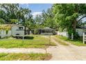 Quaint home with RV parking and white picket fence in a tranquil, tree-lined neighborhood at 1506 37Th St, Orlando, FL 32839